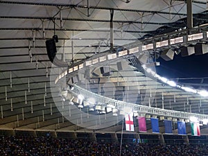 View of the roof of the tribune above the field of the football soccer stadium before the start of the game