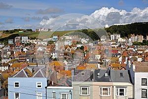 View of the roofs of Hastings old town from East Hill with West Hill in the background and beautiful clouds, Hastings, UK