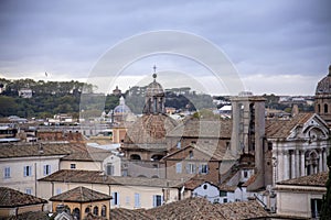 View of the roofs and historical overlays of Rome, towards the Gianicolo hill, Rome, Italy