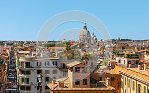 View of the roofs of houses and Via Condotti in Rome city from T photo