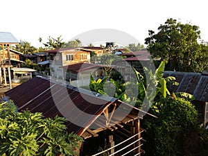 A view on the roofs in the morning in a thai village in Isaan