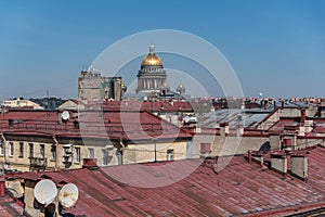 View on roofs of old buildings historic center of Sankt Peterburg and dome of St Isaac Cathedral.