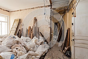 View room of the apartment and retro chandelier during under renovation, remodeling and construction