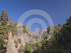 View on Roque Idafe, rock formation at ravine of the Barranco de las Angustias canyon at hiking trail Caldera de