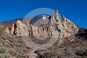 View of Roques de GarcÃÂ­a unique rock formation with famous Pico del Teide mountain volcano summit in the background on a sunrise