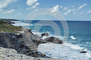 A view of rough sea water splashing against the rocks in Isla isla mujeres near Cancun, Mexico