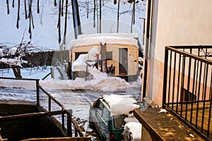 View of a roulotte Caravan and car in the snow during winter
