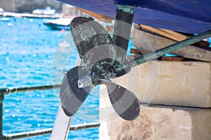 View of rudder and propeller of vessel boat staying in the dry dock