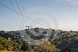 View of the rugged and bushy mountain with some modern houses