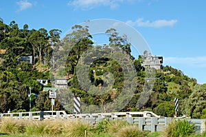 View of the rugged and bushy mountain with some modern houses in Wye River.