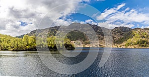 A view of the rugged peaks along the shore of Loch Katrine in the Scottish Highlands