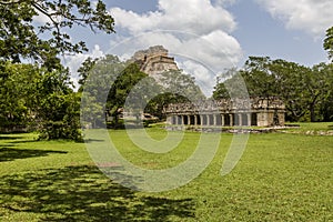 View of the ruin the house of the turtles and the pyramid El Adivino, in Uxmal photo