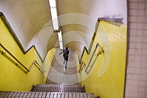 View of a running young man inside metro underground station commuting to photo