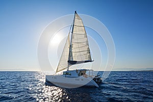 Sailing catamaran sail the Aegean sea