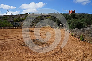 View of Saint Agatha`s Tower and surroundings with exotic vegetation. Mellieha, Malta