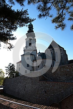 View of Saint Emmeram Basilica main tower surrounded by Nitra castle