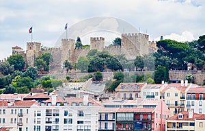 View of Saint George Castle surrounded by residential houses of Alfama. Lisbon. Portugal