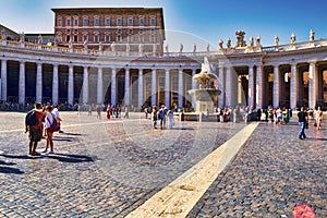 View of Saint Peter`s square with the ancient fountain - Vatican City