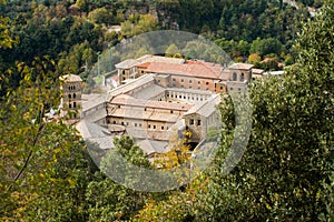 View of Saint Scholastica medieval monastery surrounded, by trees in Subiaco. Founded by Benedict of Nursia