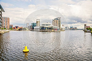 View of Salford quays in Manchester on a cloudy summer day photo