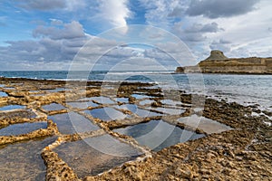 view of the salt pans in Xwejni Bay on the Maltese island of Gozo