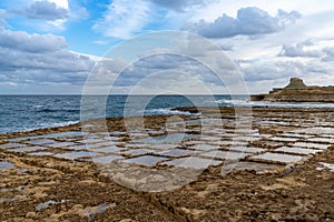 view of the salt pans in Xwejni Bay on the Maltese island of Gozo