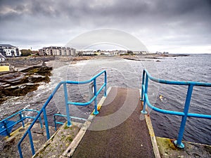 View on Salthill promenade from Blackrock diving board. Galway city, Ireland. Popular town landmark, loved by local swimmers and