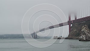 View of San Francisco Bay, Golden Gate Bridge, and Fort Point on foggy, overcast day