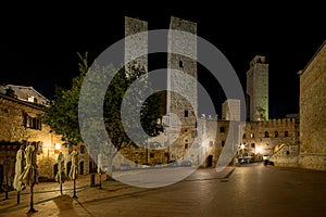 View of San Gimignano towers in Tuscany by night - Erbe square photo