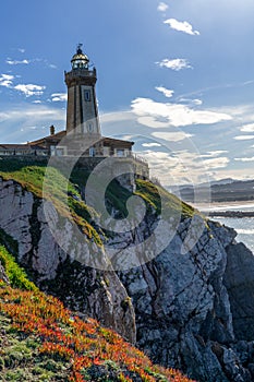 View of the San Juan de Nieva Lighthouse near Aviles in Asturias photo