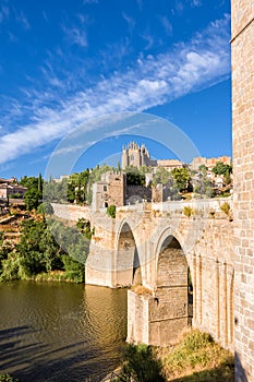 View of the San Martin Bridge crossing the Tagus to enter the old city of Toledo on the hill where you see the Old Cathedral