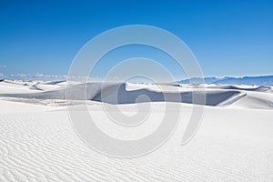 View of sand dunes and distant mountains in White Sands National Park