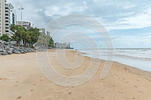 View of the sand strip of the beautiful beach of Boa Viagem in Recife photo