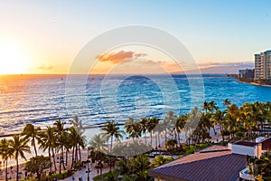 View of the sandy beach at sunset, Honolulu, Hawaii. Copy space for text