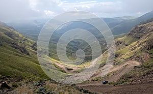 View of the Sani Pass, dirt rural road though the mountains which connects South Africa and Lesotho.