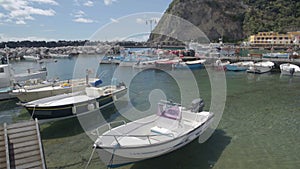View of Sant Angelo port near Ischia village, boats floating on water, Italy