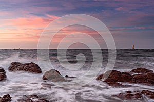 view of the Sant\'Antioco island coast and the Mangiabarche Lighthosue at sunrise on Sardinia