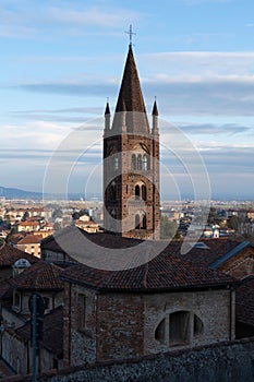 view of the Santa Maria church and bell tower in Rivoli historical city centre. Turin Piedmont Italy