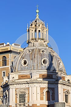 View of Santa Maria di Loreto church and shadow of Trajan`s Column on the dome, blue sky in the background, Rome, Italy