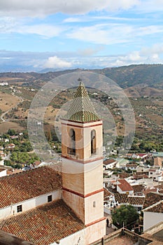 View of the Santiago Apostol church and village of Casarabonela