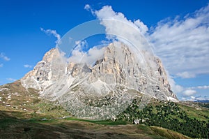 View of Sassolungo Langkofel and green valley. Dolomites, Italy