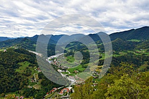 View of Sava hills in Slovene Prealps and an industrial district in the town of Lasko