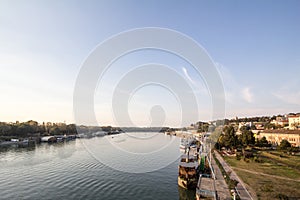 View of Sava river bank in Belgrade, Serbia,with the Kalemegdan fortress on the background and boats and ships in front