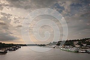 View of Sava river bank in Belgrade, Serbia, with the Kalemegdan fortress on the background and boats and ships in front, as well