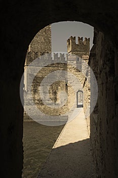 The view of Scaliger Castle, Sirmione, Lombardy, Italy. Aged photo effect
