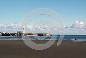 view of scarborough south bay with beach and lighthouse and harbour in summer