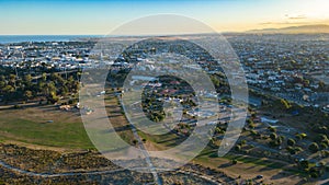 View of the scenic rural landscape of Caroline Bay and Timaru, with lush green fields and trees