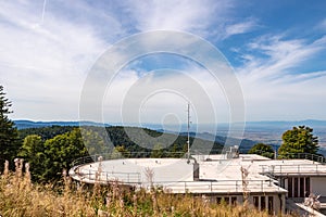 View from Schauinsland over the roof of the top station of the cable car across the Rhine valley to the Vosges mountains