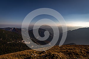 View from the Schneeberg to Rax valley with scenic blue sky