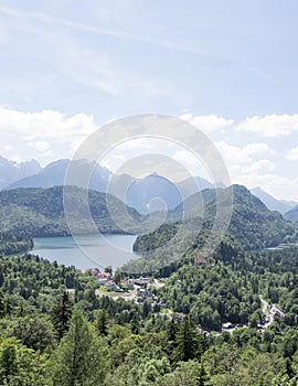 View of Schwangau town and Alpsee lake, photoshoot from Hohenschwangau castle hill